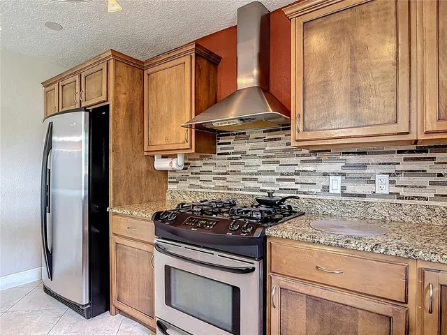 an empty room with fan and windows