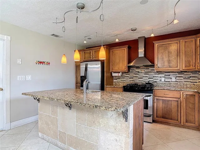 an empty room with closet and fan