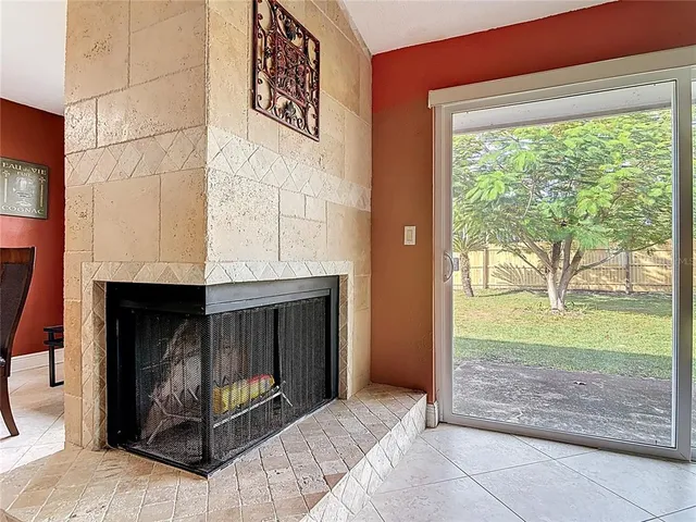 a room with a fireplace and a window