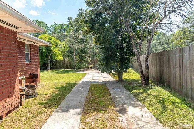 a view of swimming pool with a backyard