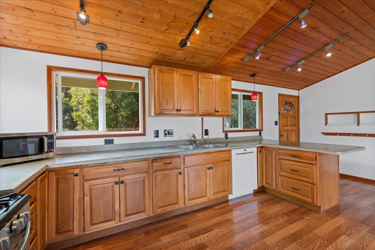 31 Hapapa Road, Unit B Kula, HI 96790 - Photo 10 of 50 a kitchen with sink cabinets and wooden floor