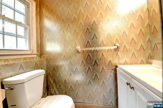 a bathroom with a sink and toilet