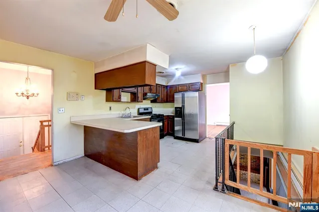 a kitchen with stainless steel appliances granite countertop a stove and a sink