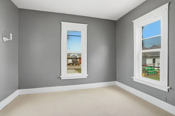 an empty room and window