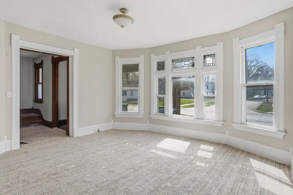 a view of an empty room with a window
