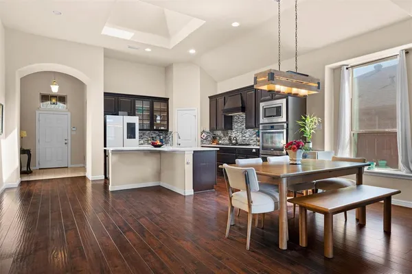 a view of a dining room with furniture window and wooden floor