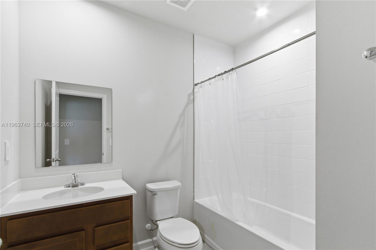 323 Raspberry Road, Unit 323 Fort Pierce, FL 34981 - Photo 21 of 29 a bathroom with a sink toilet and shower
