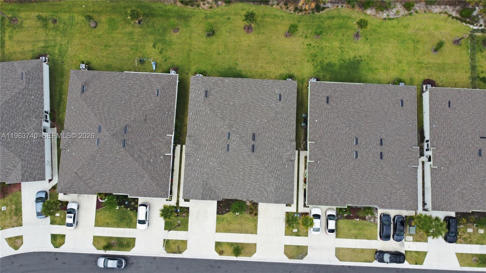 323 Raspberry Road, Unit 323 Fort Pierce, FL 34981 - Photo 29 of 29 an aerial view of residential houses with outdoor space and parking