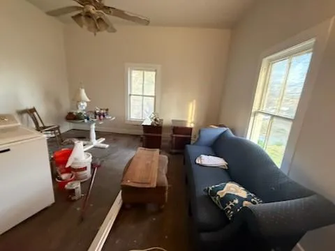 a living room with furniture and a window