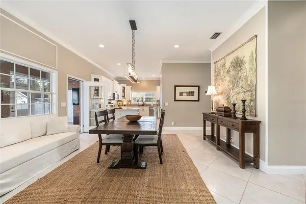 a living room with furniture a window and a chandelier