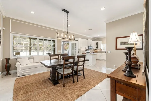 a kitchen with a sink a counter top space stainless steel appliances and cabinets