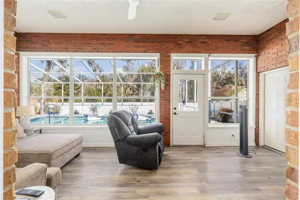 a kitchen with stainless steel appliances kitchen island granite countertop a refrigerator and a stove top oven