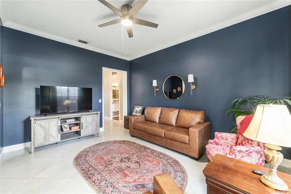 a living room with furniture fireplace and flat screen tv