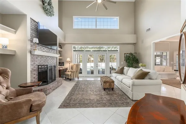 a living room with furniture flat screen tv and a fireplace