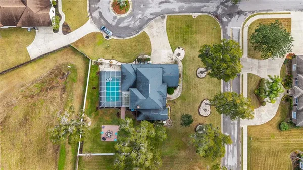 a view of a swimming pool with a patio