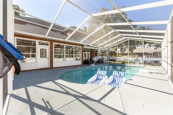 a view of a swimming pool with a patio