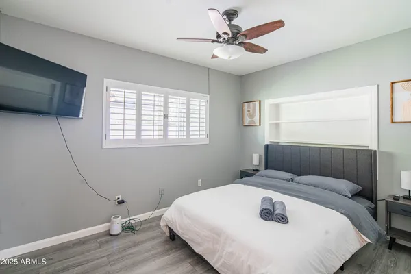 a bedroom with a bed and a window
