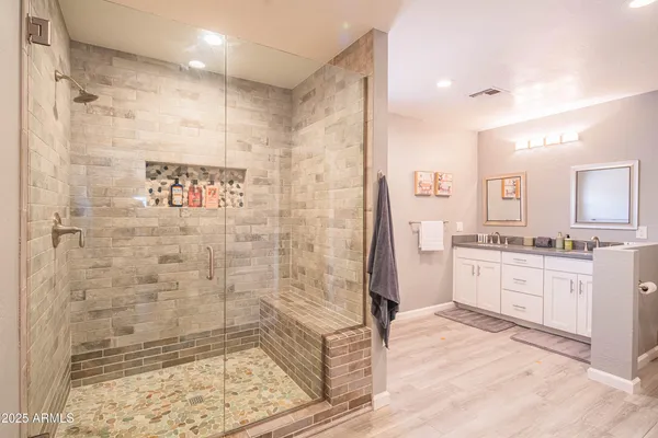 a bathroom with a sink and a mirror