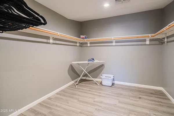 a bedroom with two beds and a window