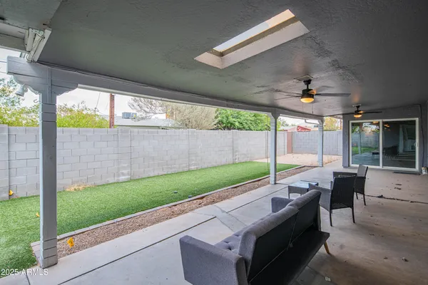 a view of a backyard with a small garden