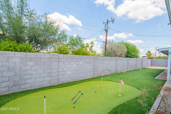 a bedroom with a bed and a lamp