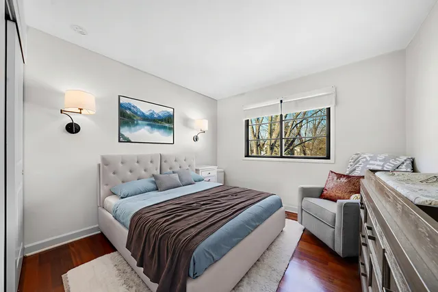 a bedroom with a bed and a couch