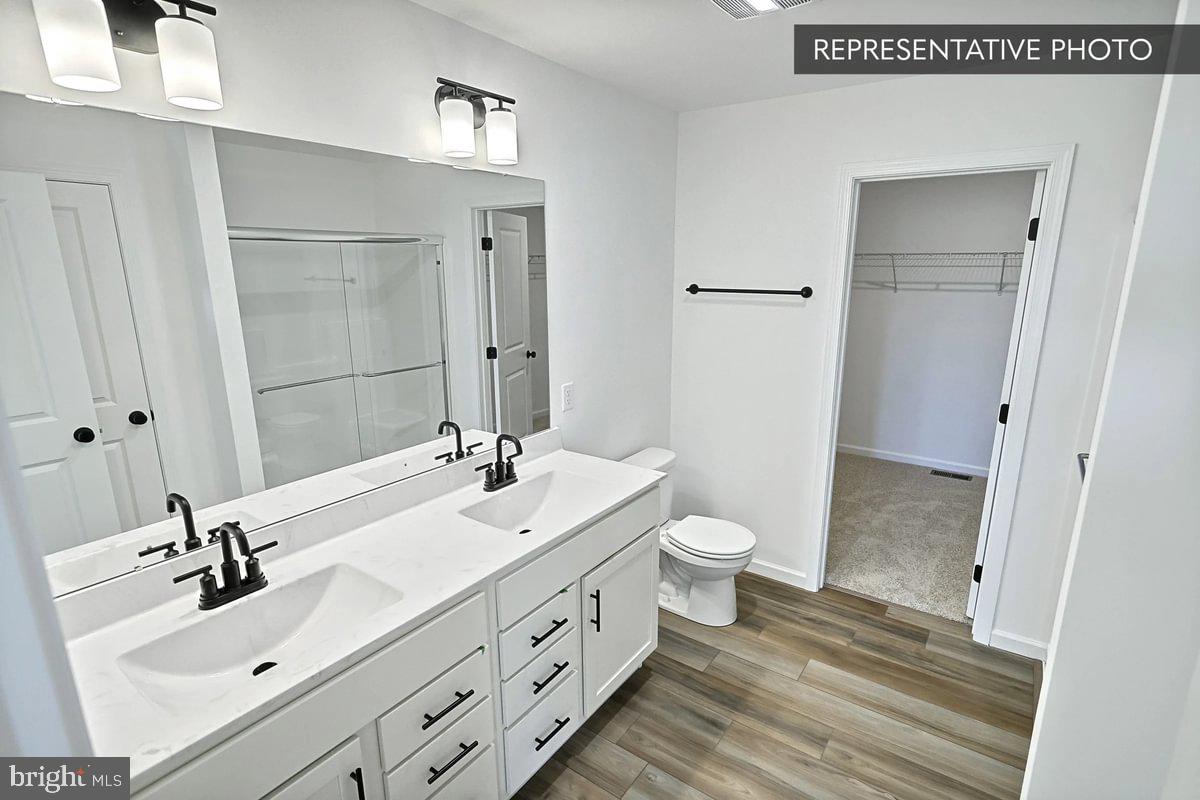 6309 Liam Drive Spring Grove, PA 17362 - Photo 14 of 20 a bathroom with a double vanity sink mirror and toilet