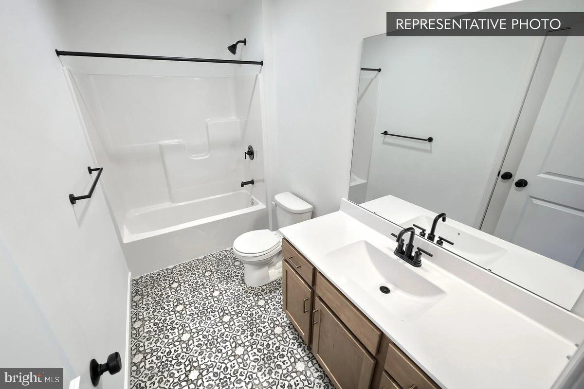 6309 Liam Drive Spring Grove, PA 17362 - Photo 19 of 20 a bathroom with a sink a toilet a mirror and shower