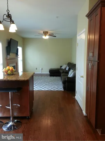 a living room with furniture and chandelier