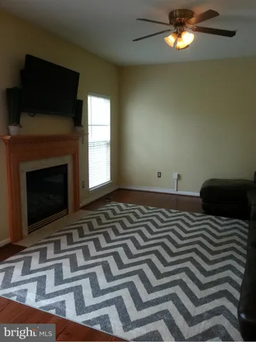 a bedroom with a bed and a fireplace