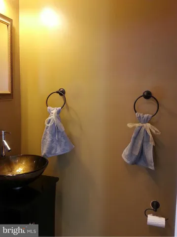 a room with a table and a chandelier