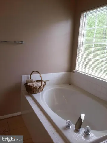 a bathroom with a sink vanity and a toilet