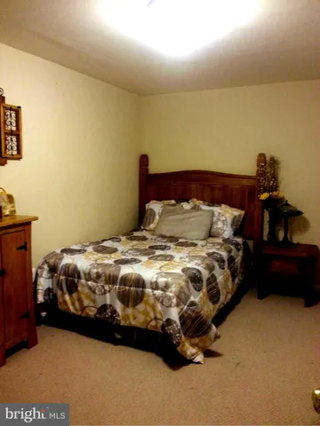 a white toilet sitting next to a small bathroom