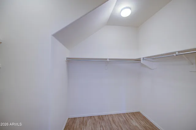 a view of a room with shelf on the wall