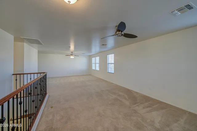 a view of an empty room with windows