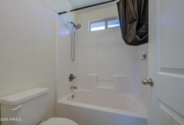 a bathroom with a bath tub and a shower