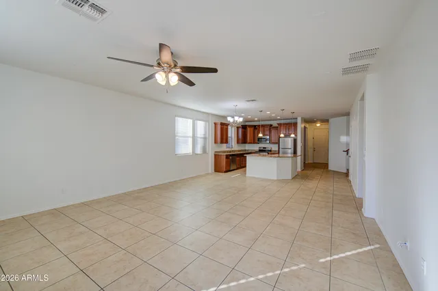 a view of a kitchen with furniture and a ceiling fan