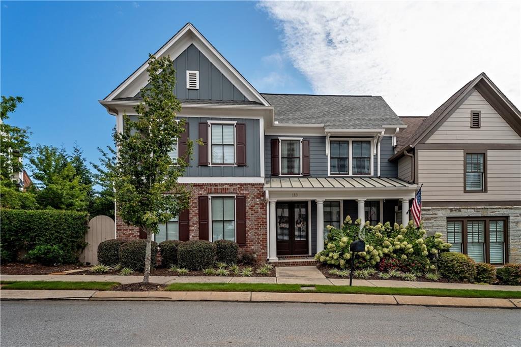 183 Fowler Street Woodstock, GA 30188 - Photo 1 of 1 a front view of a house with garden