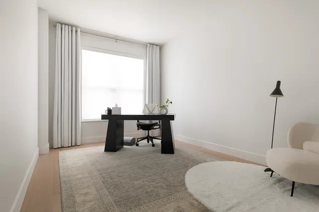 a workspace with furniture and window