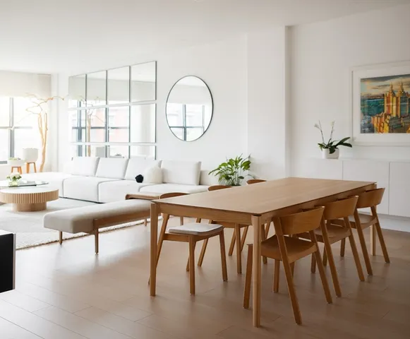 a view of a dining room with furniture and a large window