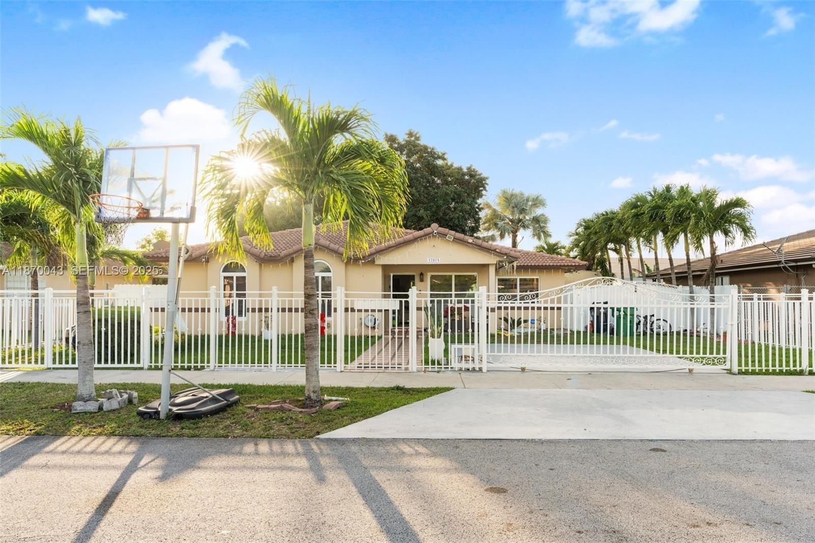 17874 Southwest 114th Avenue Miami, FL 33157 - Photo 1 of 18 a view of a house with backyard and porch