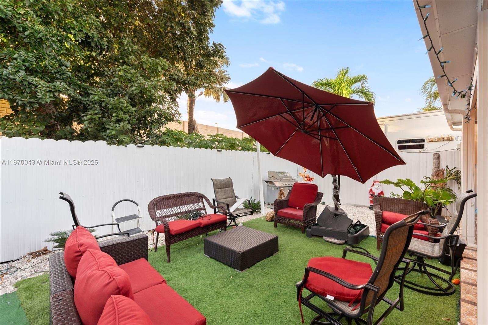 17874 Southwest 114th Avenue Miami, FL 33157 - Photo 18 of 18 a view of a backyard with furniture and a table