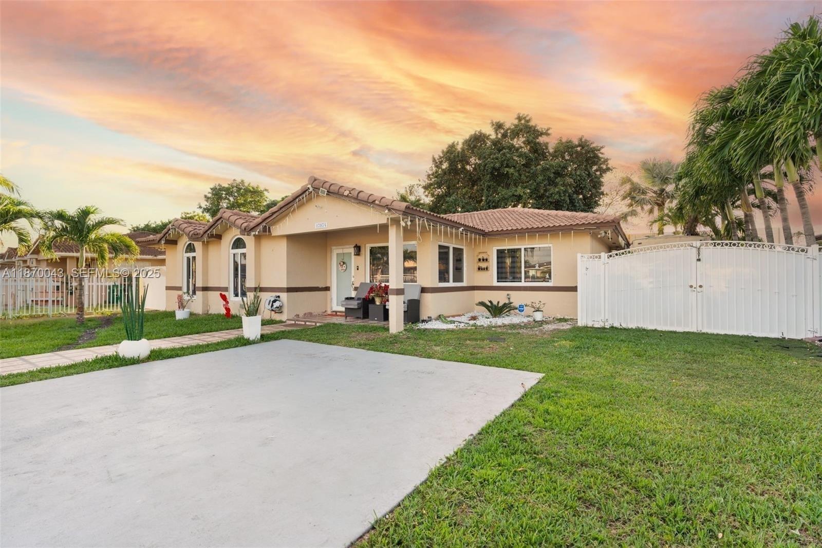 17874 Southwest 114th Avenue Miami, FL 33157 - Photo 2 of 18 a view of an house with backyard and a tree