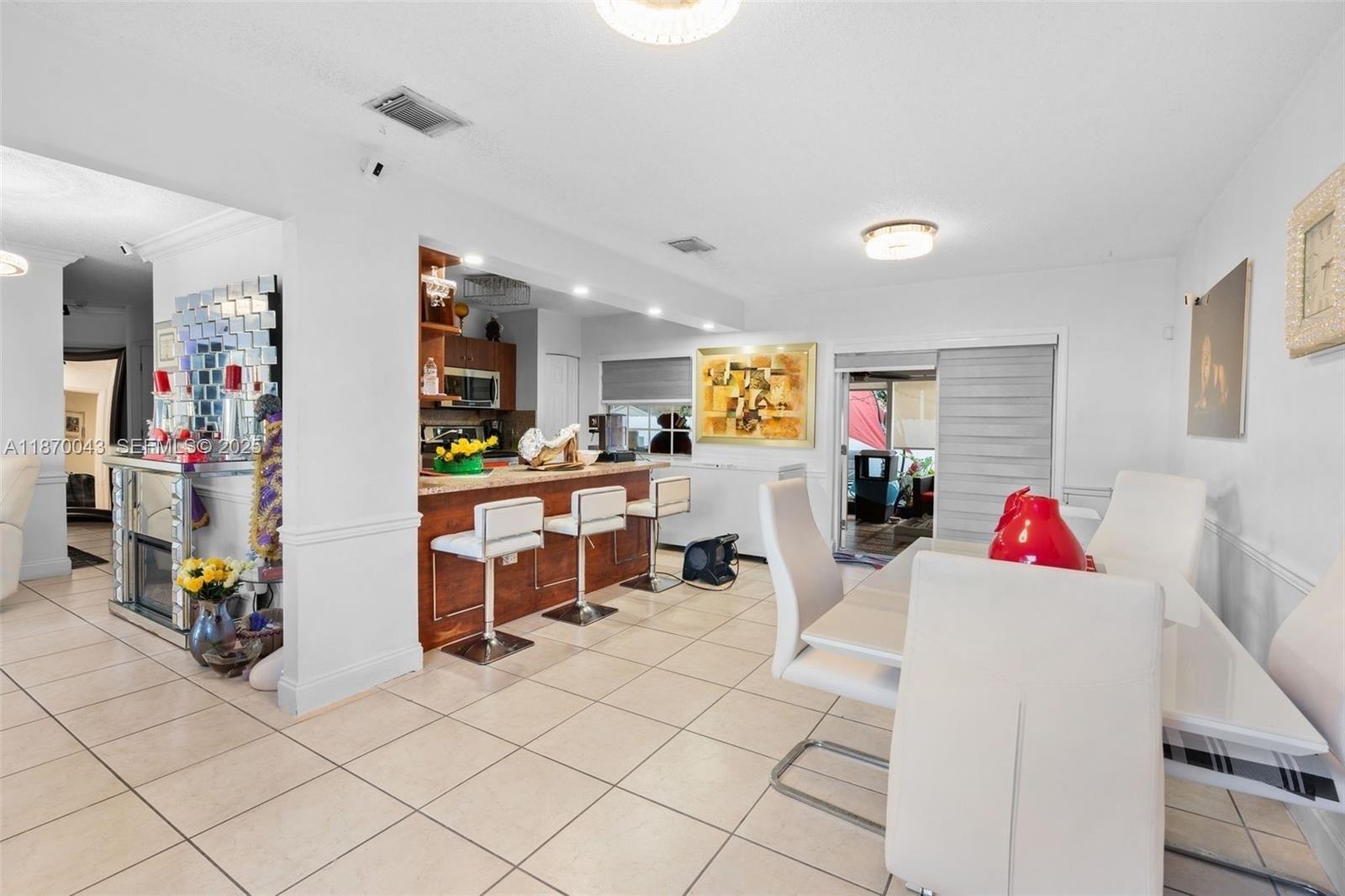 17874 Southwest 114th Avenue Miami, FL 33157 - Photo 7 of 18 a living room with furniture and a wooden floor