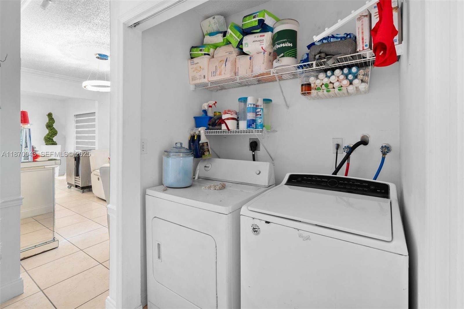 17874 Southwest 114th Avenue Miami, FL 33157 - Photo 10 of 18 a storage room with washer and dryer