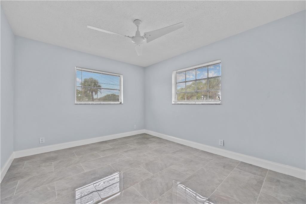 260 Northwest 19th Street, Unit 290 Boca Raton, FL 33432 - Photo 13 of 18 a view of room with window and ceiling fan