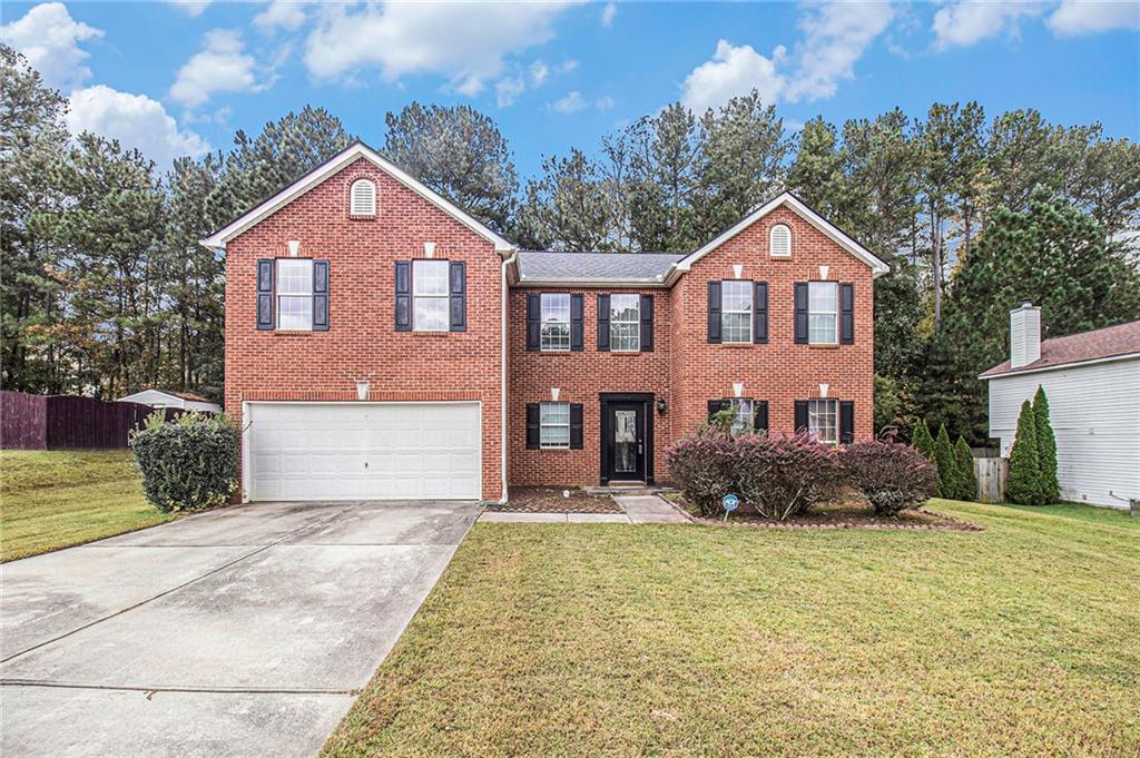 front view of a house with a yard