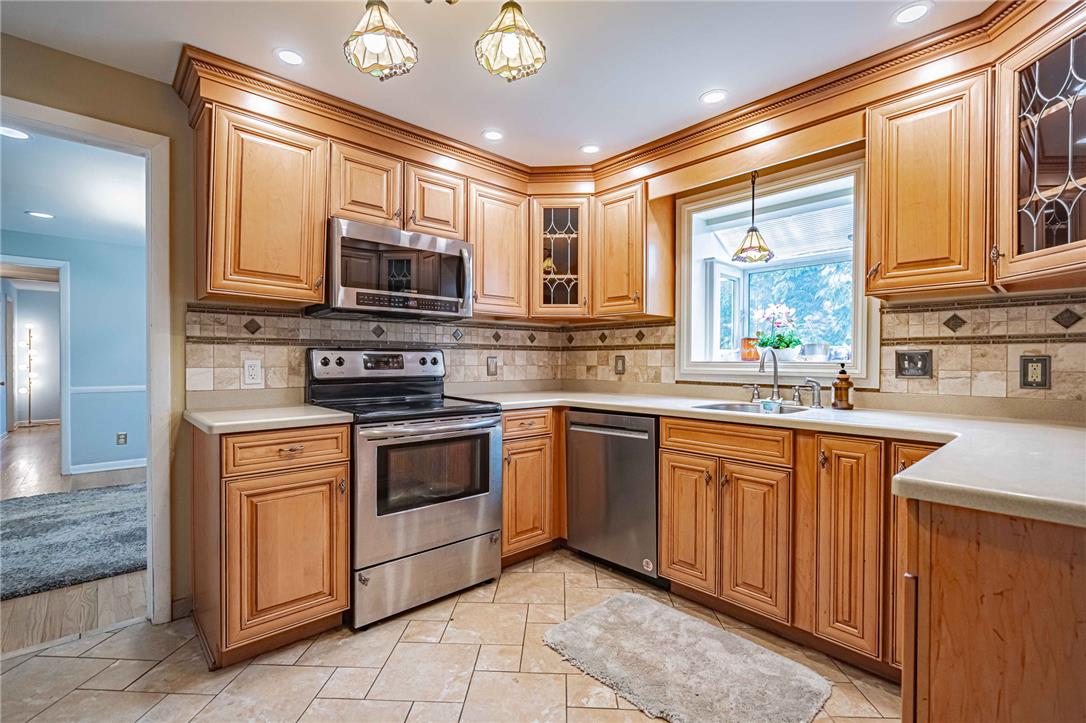 285 Bridle Path Road Bethlehem, PA 18017 - Photo 18 of 54 a kitchen with stainless steel appliances granite countertop a stove sink and microwave
