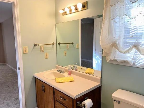 a bathroom with a sink and mirror