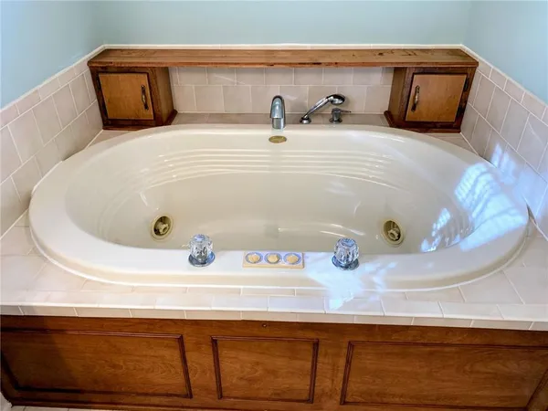 a bathroom with a sink and mirror